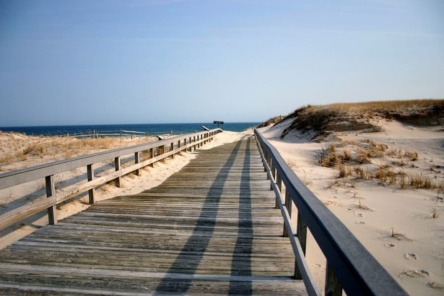 A picture of a boardwalk in New Jersey leading to the beach.